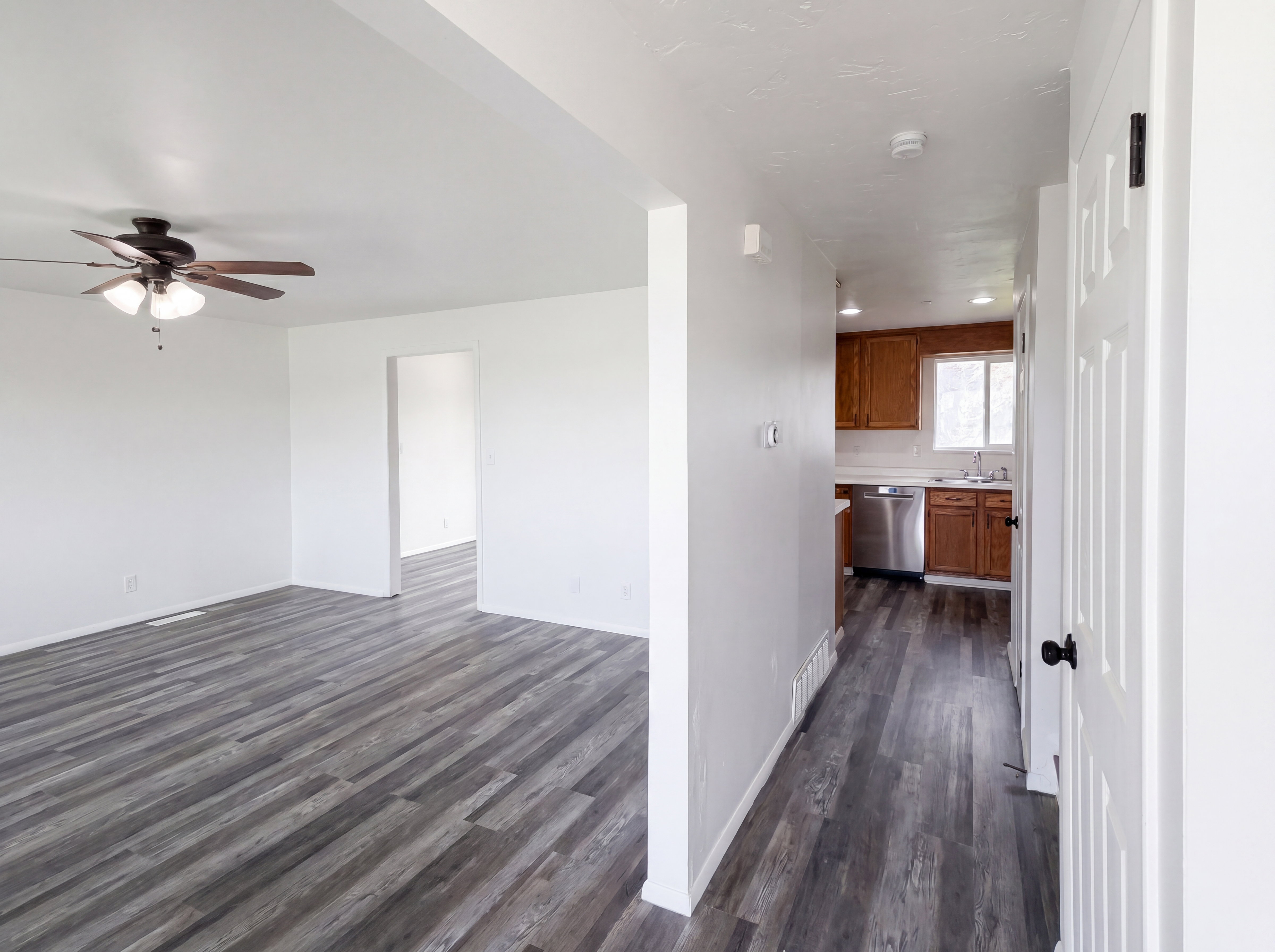 Hall featuring dark wood finished floors
