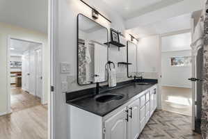 Basement bathroom leading into basement master bedroom