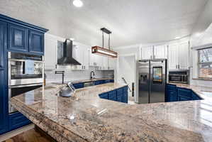 Kitchen showing double oven.