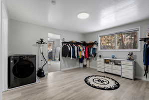 Closet in master bedroom with laundry