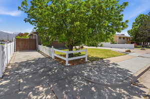 View of front of property featuring a fenced front yard and driveway with RV Parking