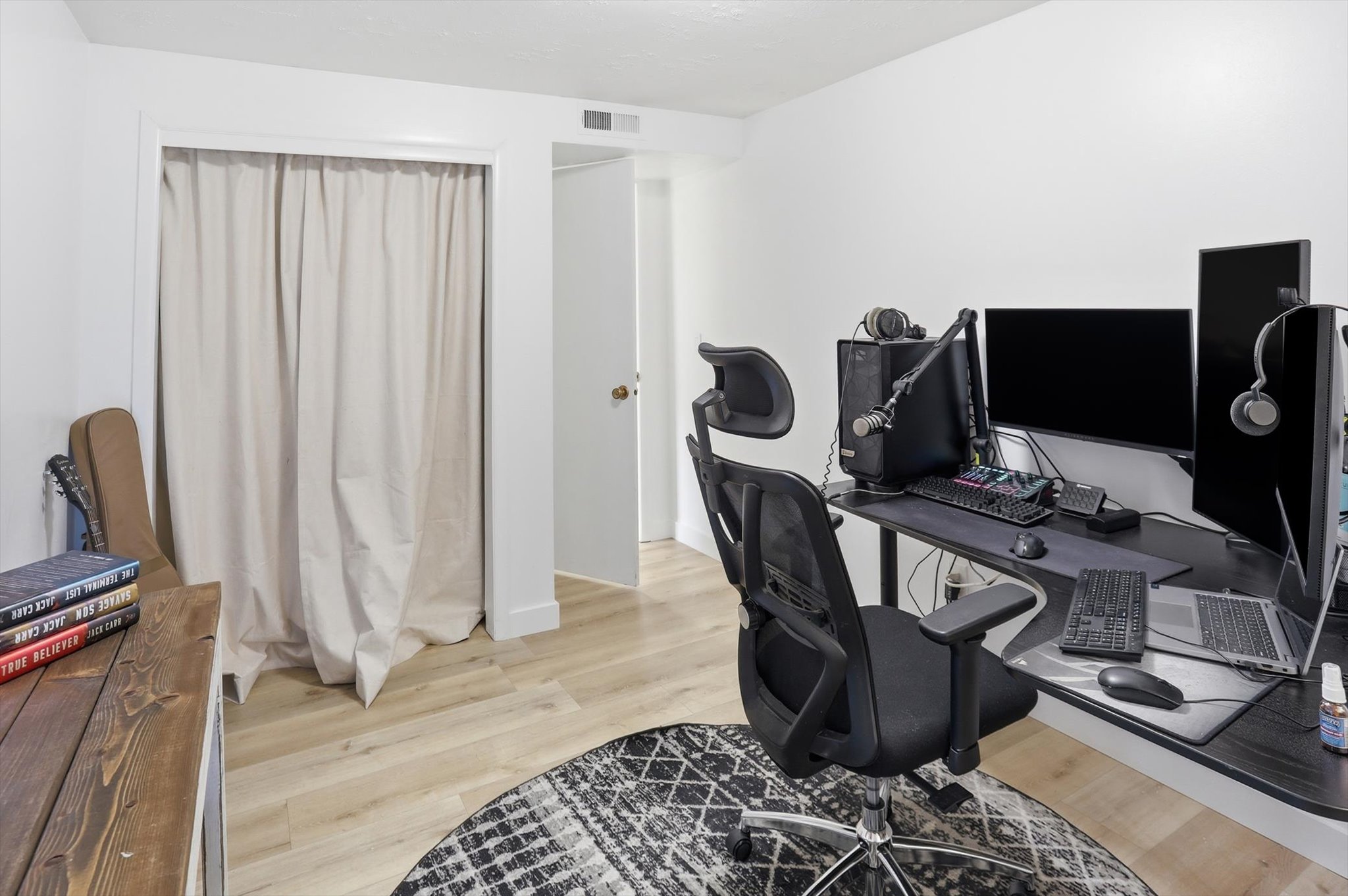 Office area with light wood-style floors