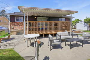 View of patio / terrace with outdoor seating and a shed