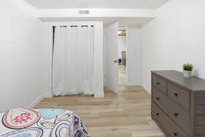 Bedroom with light wood-style flooring