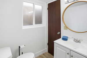 Bathroom with vanity and light wood-style floors