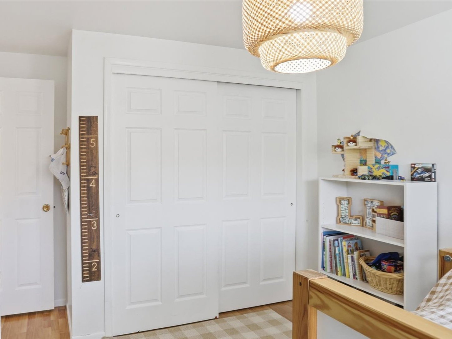 Bedroom featuring a closet and light wood-type flooring