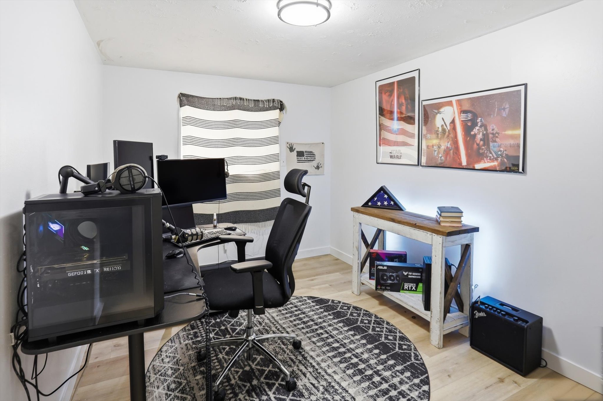 Office with light wood-style floors and baseboards