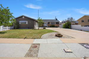 Ranch-style home with concrete driveway