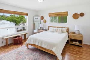 Bedroom featuring light wood-style floors and baseboards