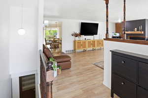 Living area with light wood-style floors