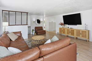 Living area with light wood-style flooring