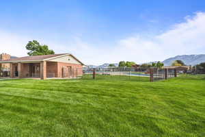 Nearby community green space with open lawn and pavilion area.
