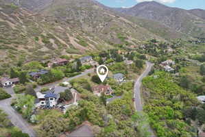 Aerial perspective of suburban area featuring a mountain backdrop
