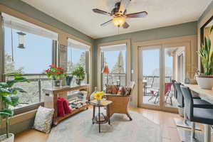 Sunroom with wood finished floors