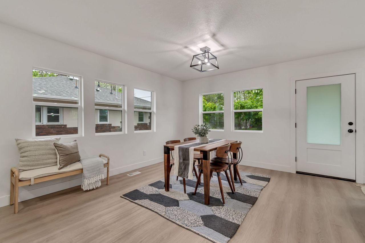 Dining area featuring light wood finished floors and plenty of natural light