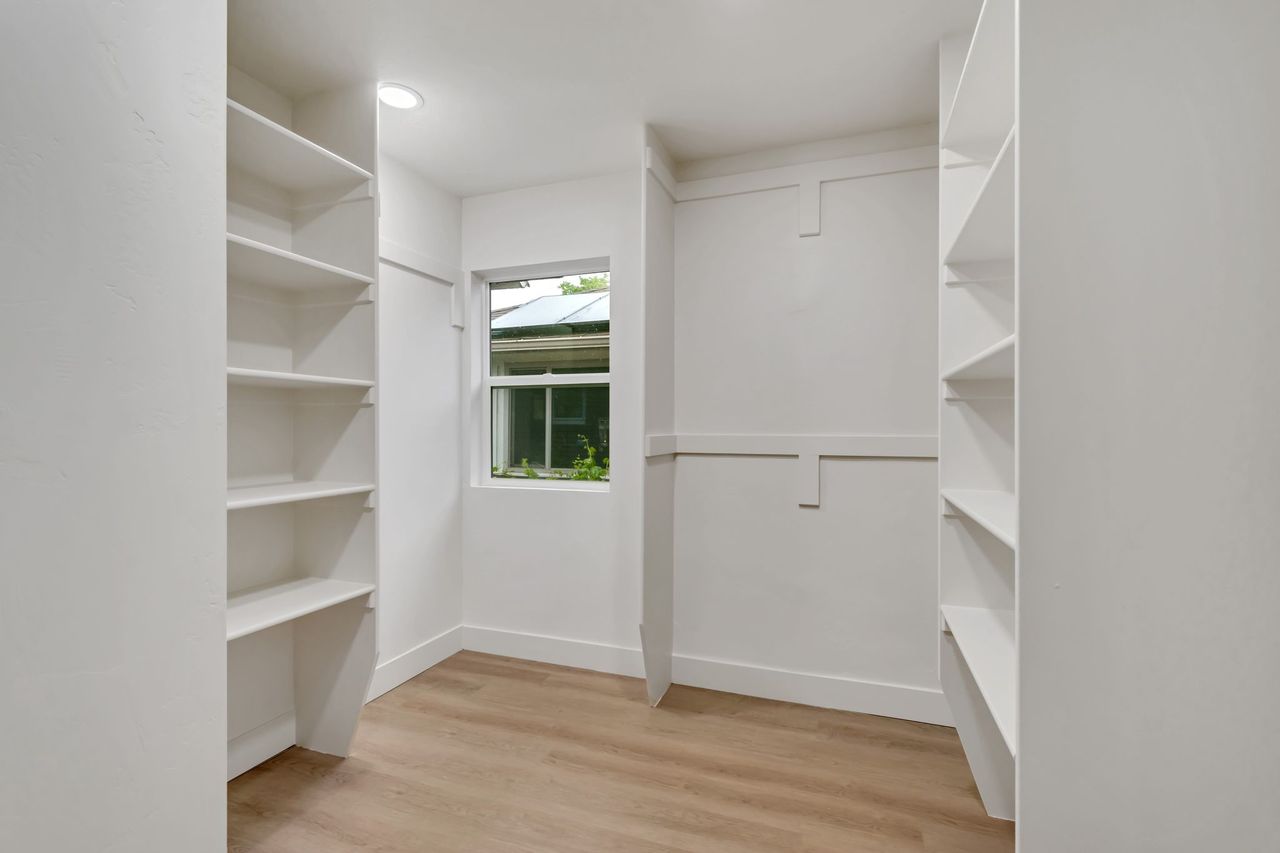 Walk in closet featuring light wood-type flooring