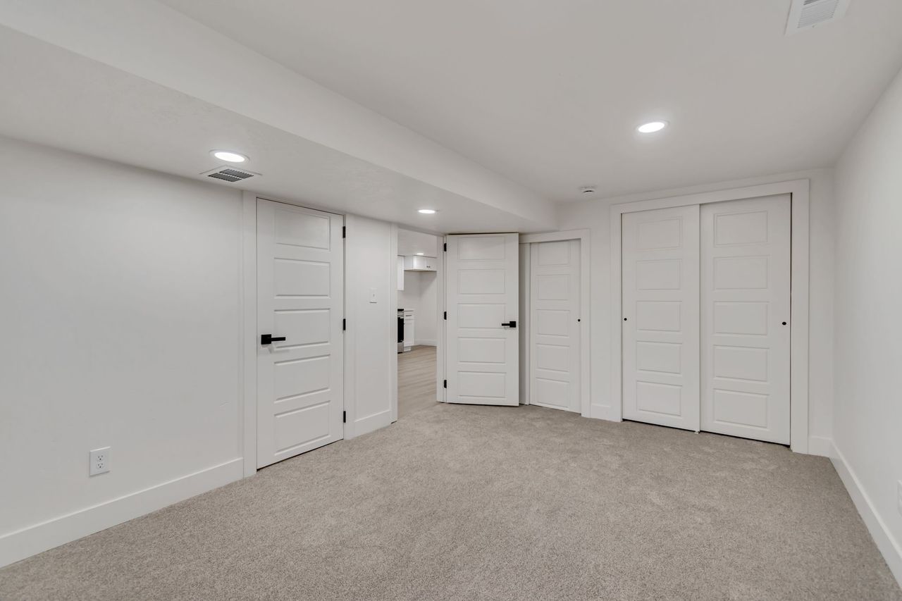 Unfurnished bedroom featuring carpet flooring and recessed lighting