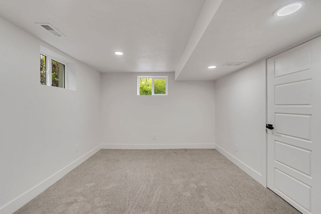 Basement with carpet flooring and recessed lighting