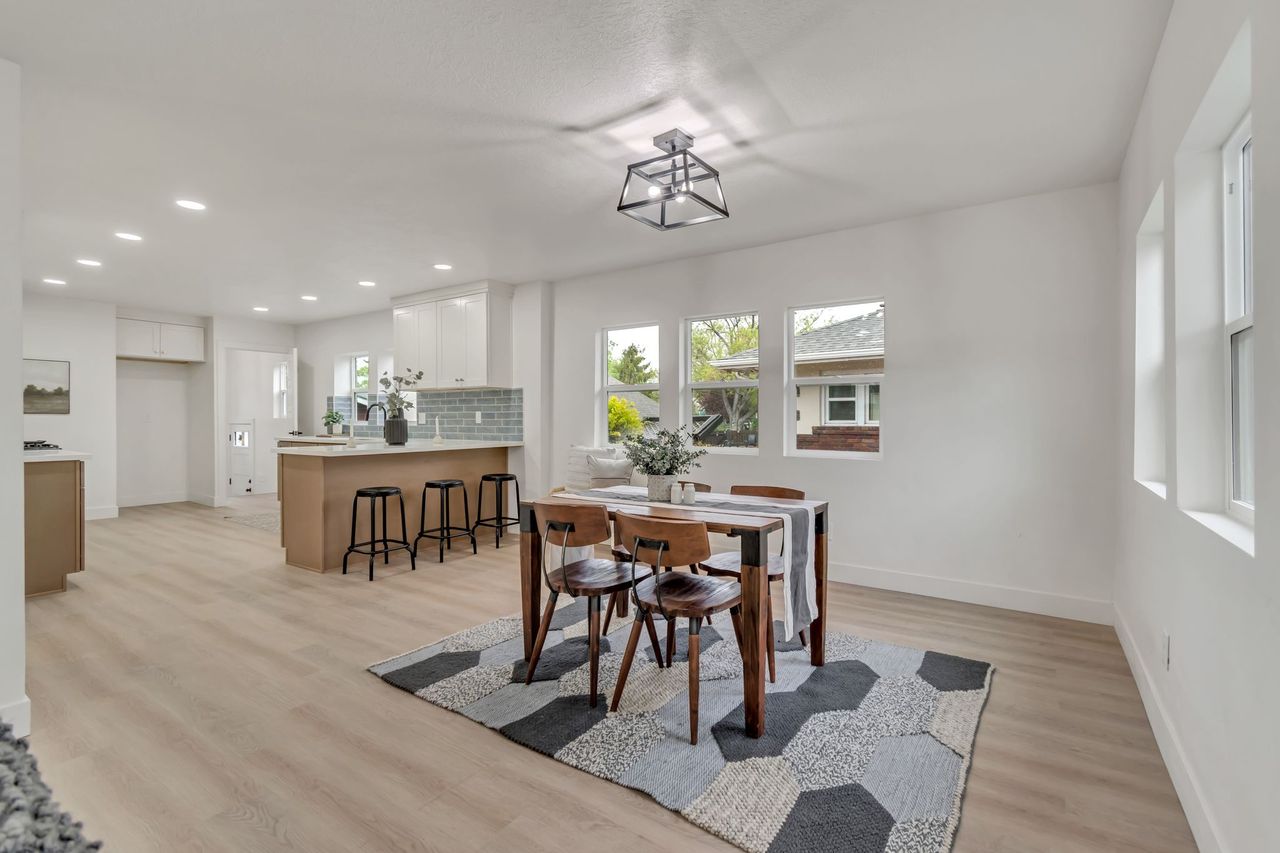 Dining area featuring light wood-style floors and recessed lighting
