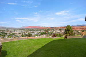 View of grassy yard featuring a mountain view
