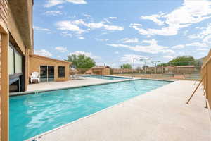 Community pool with a patio area