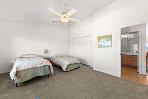 Bedroom featuring carpet, a closet, and ceiling fan