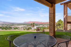 View of patio / terrace with outdoor dining area and a mountain view