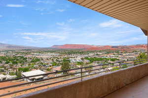 Balcony with a mountain view and a residential view
