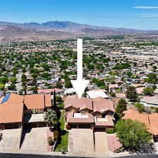 Aerial perspective of suburban area with a mountain backdrop