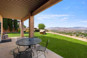 View of patio featuring a mountain view and outdoor dining space