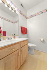 Bathroom featuring light floors and vanity