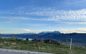 View of mountain backdrop featuring rural landscape