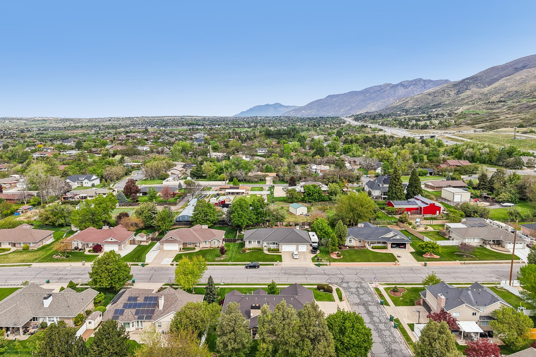 Aerial view of residential area featuring mountains