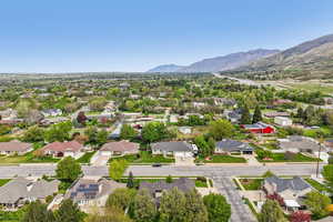 Aerial view of residential area featuring mountains