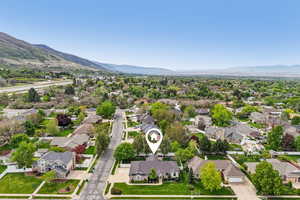 Aerial perspective of suburban area with a mountainous background