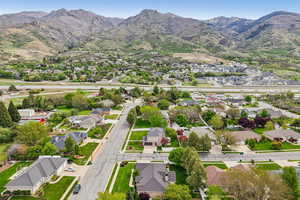 Aerial perspective of suburban area featuring a mountain backdrop