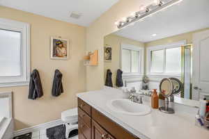 Full bath with vanity, a bath, light tile patterned flooring, and a stall shower
