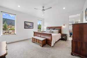Bedroom featuring light carpet, ceiling fan, and recessed lighting