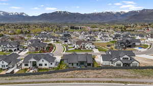 Aerial perspective of suburban area with a mountain backdrop