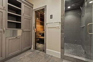 Bathroom featuring a relaxing sauna and a shower stall