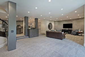 Living room featuring recessed lighting and light carpet