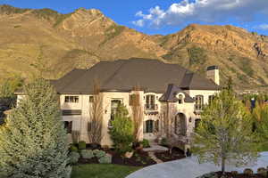 View of front of house featuring a mountain view and a chimney