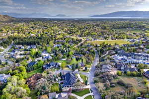 Aerial overview of property's location with mountains and nearby suburban area