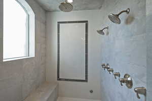Bathroom featuring tiled shower
