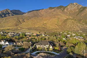 Aerial view of residential area featuring mountains