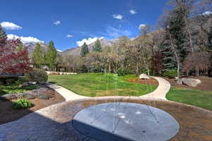 View of grassy yard featuring a mountain view