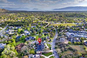 View of property location with a mountain backdrop and nearby suburban area