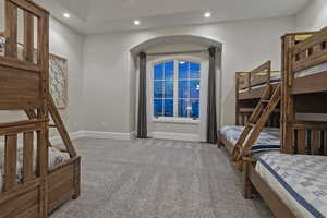 Bedroom featuring light carpet and recessed lighting