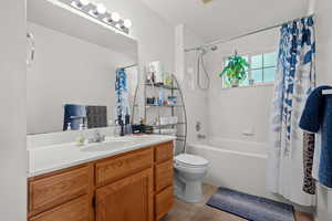Bathroom with vanity and shower / tub combo