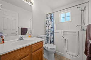 Bathroom with vanity and a shower with curtain